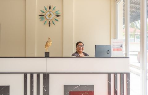 A member of the Sea Horizon team at the reception desk
